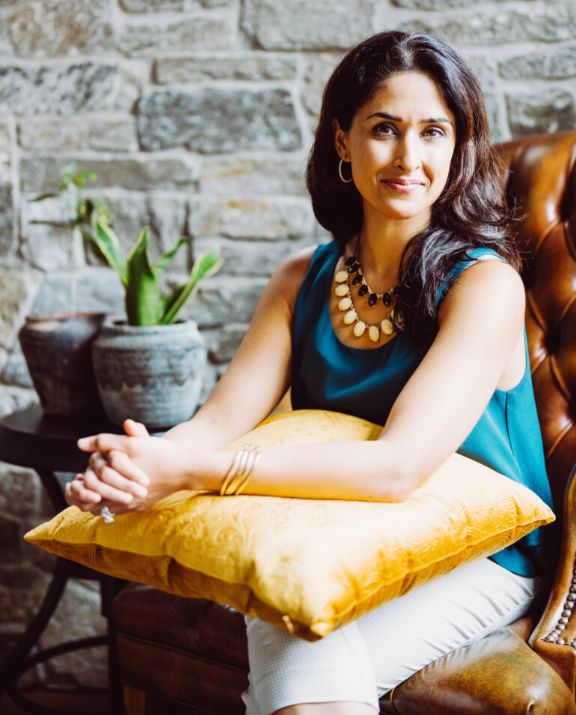 Dr. Shahana Alibhai seated on a chair